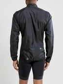 Veste légère Craft ADV Essence Light Wind Jacket noire pour course et vélo avec protection coupe-vent et détails réfléchissants.