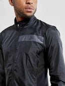 Veste légère Craft ADV Essence Light Wind Jacket noire pour course et vélo avec protection coupe-vent et détails réfléchissants.