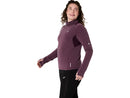 Chandail de course Asics NAGINO Run Winter LS pour femme avec tissu brossé à séchage rapide, col montant, panneaux en mesh respirants et passe-pouces, conçu pour la course par temps frais et hivernal.