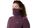 Chandail de course Asics NAGINO Run Winter LS pour femme avec tissu brossé à séchage rapide, col montant, panneaux en mesh respirants et passe-pouces, conçu pour la course par temps frais et hivernal.