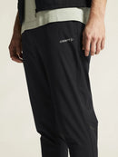 Pantalon d’entraînement Craft Essence Training Pants 3 pour homme noir extensible et respirant avec poches zippées