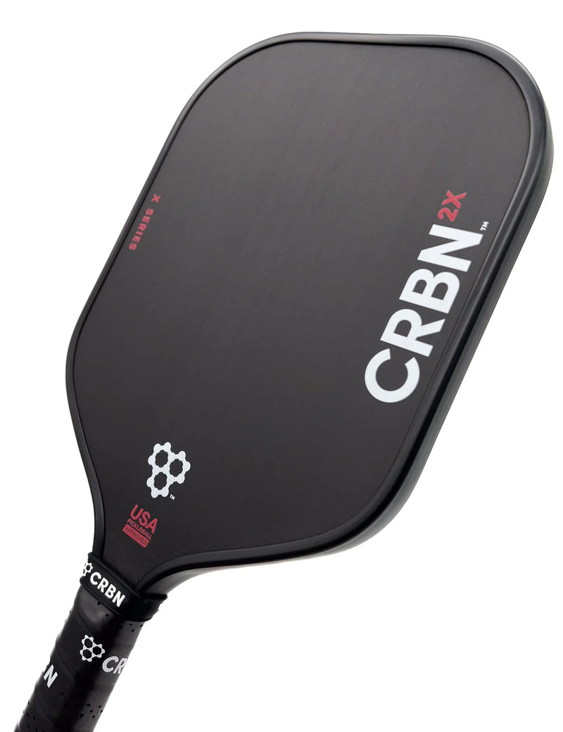 Raquette de pickleball CRBN 2X16 – face carbone brut T700, noyau 16 mm, design square, puissance et spin pour joueurs pro.