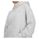 Chandail à capuchon New Balance Athletics pour femme avec coupe oversized et logo brodé.