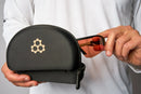 Lunettes de pickleball CRBN Pivot avec monture modulaire, trois lentilles interchangeables (photochromique, Orange Mirrored et Amber), étui rigide et insert pour verres correcteurs.