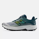 Chaussures de trail New Balance FuelCell Rebel Trail avec amorti FuelCell et semelle Vibram Megagrip offrant légèreté, traction et performance sur les sentiers.