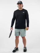Chandail de performance Selkirk Essentials Sport-Wik noir à manches longues pour homme conçu pour le pickleball avec tissu respirant et séchage rapide.